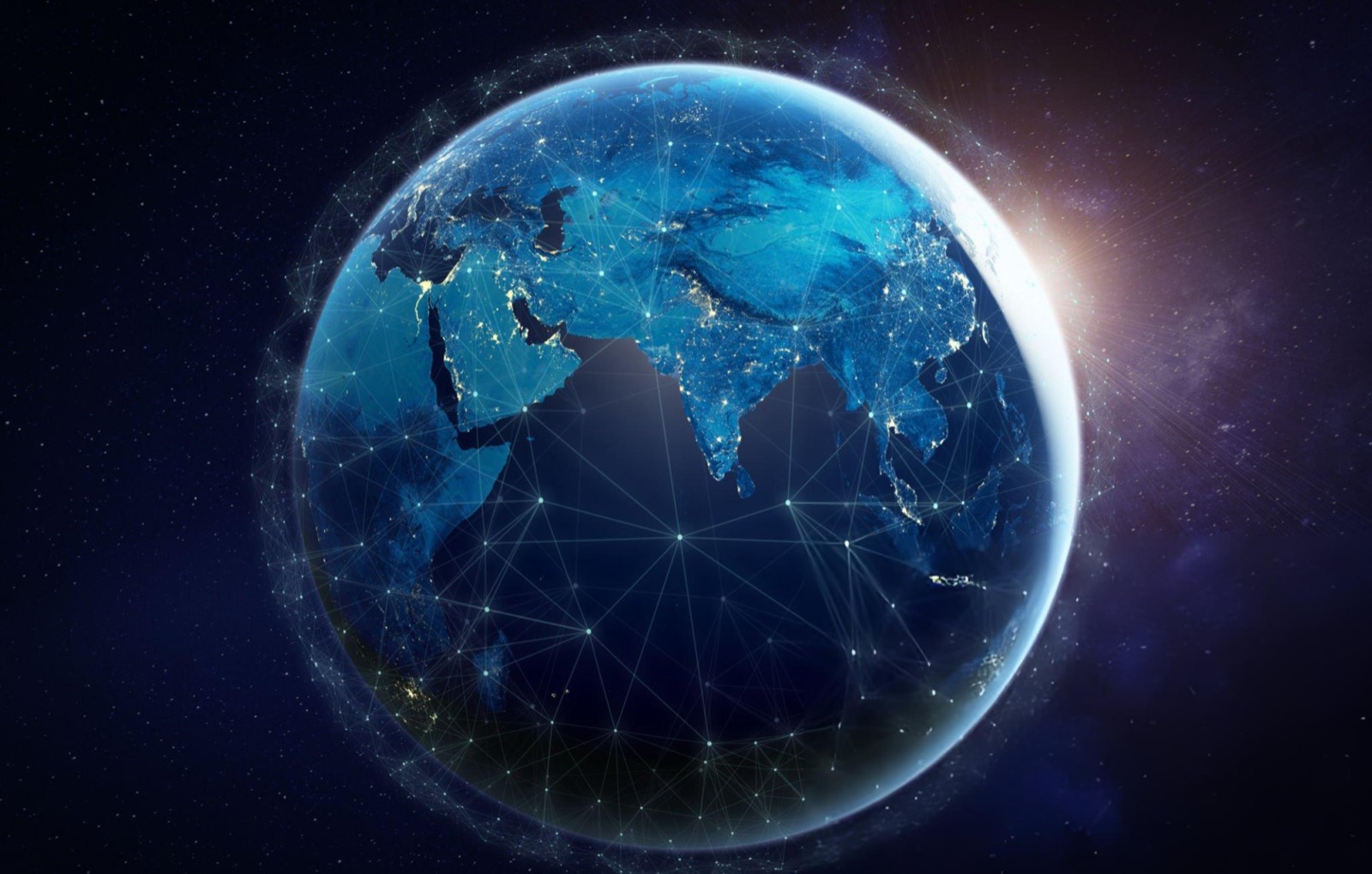 Earth at night with illuminated trade routes across the Middle East and Asia
